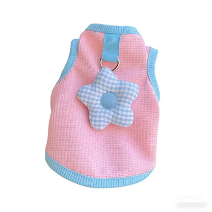 leash-set.jpg	A collection of pastel-colored waffle pet harnesses with 3D flower charms and matching leashes.